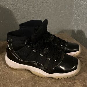 Men’s size 6.5 Jordan 11 Jubilee Black and White Sneakers